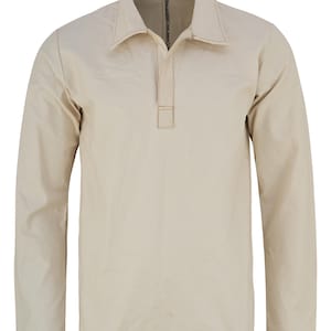 May include: A beige long-sleeved shirt with a button-up collar and a single button closure at the neck.