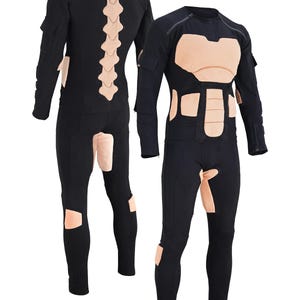 May include: Black full-body suit with padded sections on the chest, back, and legs. The padding is a light brown color.