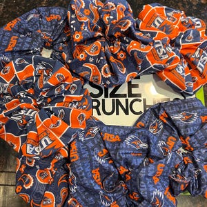 Texas Size UTSA Scrunchie for University Of Texas At San Antonio Go Roadrunners.  Approximately 7 inches wide from left to right
