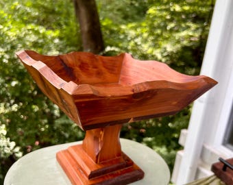 Handcrafted wooden pedestal bowl-compote with a scalloped rim. 8” tall. 9” wide.