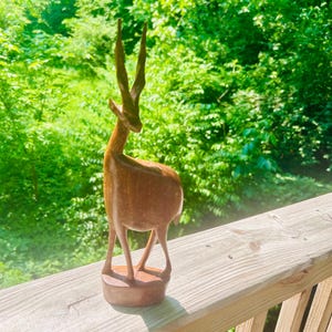 Gazelle-Impala-Hand carved-Kenya-Africa. Stands 12+” tall and 4” wide. Vintage. Great condition. Light colored wood. Hsndmade artisan. Gift.
