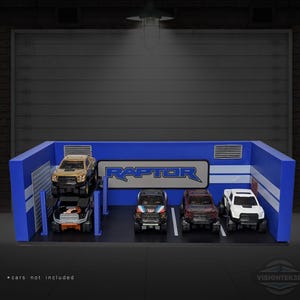 May include: A blue and white toy garage with the word "RAPTOR" in a blue and silver logo. Four toy trucks are parked inside. The text "* cars not included" is at the bottom.