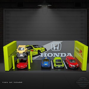 May include: A display stand featuring a Honda logo and the text "HONDA". The stand has a gray background with a yellow and black car graphic. Several toy cars are on display, including a yellow truck, a red car, a blue car, and a green car.