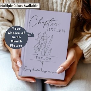 May include: A lavender journal with the words "Chapter SIXTEEN" and the name "TAYLOR" printed on the cover. The journal features a floral design and the text "Every chapter brings new grow." The text "Multiple Colors Available" is also visible.