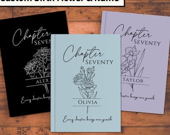 May include: Three personalized notebooks with floral designs. The notebooks are in black, light blue, and lavender. Each notebook features the text "Chapter Seventy" and a name, with the phrase "Every chapter brings new growth."