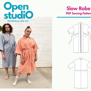 May include: Two people wearing robes, one blue and one peach, stand in front of a white brick wall. The text "Open studio" is in a circle with a blue background. The text "Slow Robe PDF Sewing Pattern" is in a pink rectangle.