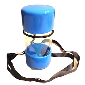 May include: A blue and clear plastic container with a black strap. The container has a shark fin logo on the side.