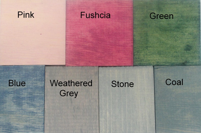 May include: A set of eight wood samples stained in different colors, including pink, fuschia, green, blue, weathered grey, stone, and coal.
