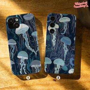 May include: Two phone cases featuring a blue and white jellyfish design. The cases are designed for different phone models. Both cases are dark blue with white jellyfish and white outlines.