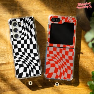 May include: Two phone cases with a checkered pattern. The case on the left is black and white, while the case on the right is red and white. Both cases have a wavy, distorted checkered pattern.