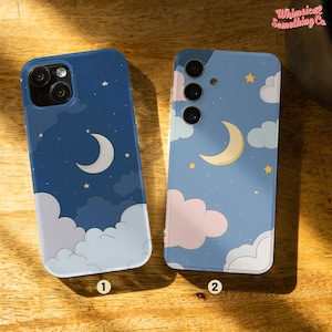 May include: Two phone cases with a night sky design. The cases feature a crescent moon, stars, and clouds on a blue background. The text "Whimsical Something Co." is visible in the top right corner of the image.