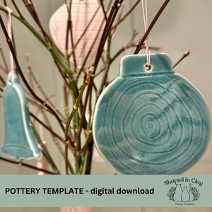 May include: A teal blue ceramic ornament with a swirl pattern hanging on a branch. The ornament is a pottery template for a digital download. The text "Shaped In Clay Pottery Templates" is in the bottom right corner of the image.