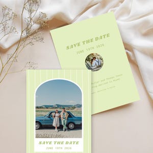 May include: A green and white striped save the date card with a photo of a couple standing in front of a blue car. The text "SAVE THE DATE" is in a retro font and the date "JUNE 19TH 2026" is below it.