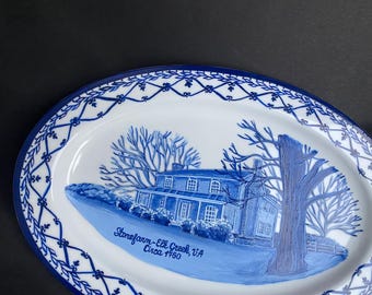 May include: Oval serving platter with a blue and white design. The platter features a detailed illustration of a house and trees, with the text "Stonefarm-Elk Creek, VA Circa 1960". The border has a decorative blue pattern.