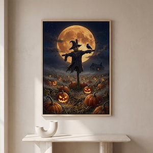 Può includere: Stampa incorniciata a tema Halloween con uno spaventapasseri in un campo di zucche illuminate dalla luna piena. Un corvo è posato sul braccio dello spaventapasseri. L'opera d'arte evoca un'atmosfera spettrale e autunnale.