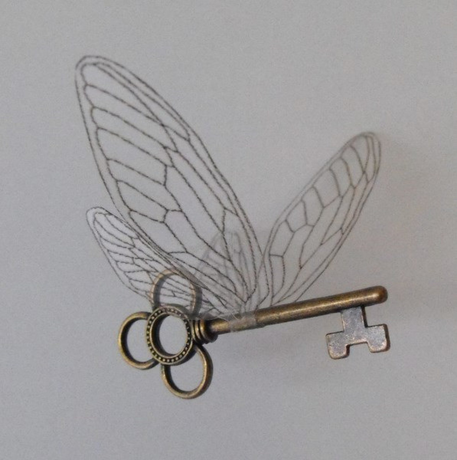 Winged 'magical' key with large wings in antique brass Etsy