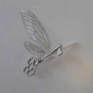 Flying &#39;magical&#39; key with large wings in shiny silver - SSSCTLP