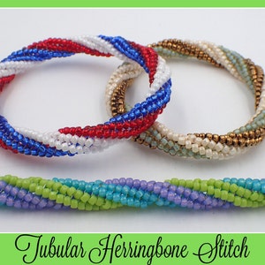May include: Three beaded bracelets in a tubular herringbone stitch. One bracelet features red, white, and blue beads. Another has gold, cream, and light green beads. A separate strand of beads displays a pattern of green, blue, and purple. The text "Tubular Herringbone Stitch" is below.