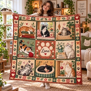May include: A quilted throw blanket featuring a grid of nine panels with various cat illustrations, floral borders, and a central paw print graphic with the name Luna. The design includes cats sleeping, playing with yarn, and sitting near books.