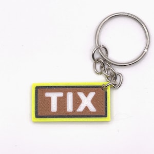 Colorful Roblox Tix Keychain - Elevate Your Style Game with this Fun Video Game Accessory