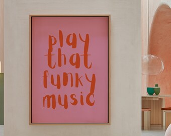 Puede incluir: Un lienzo rosa enmarcado con el texto "Play that funky music" escrito en naranja.