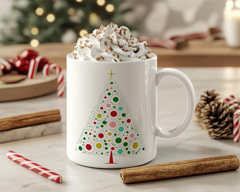 May include: White ceramic mug with a colorful Christmas tree design. The mug is filled with a white, foamy beverage.