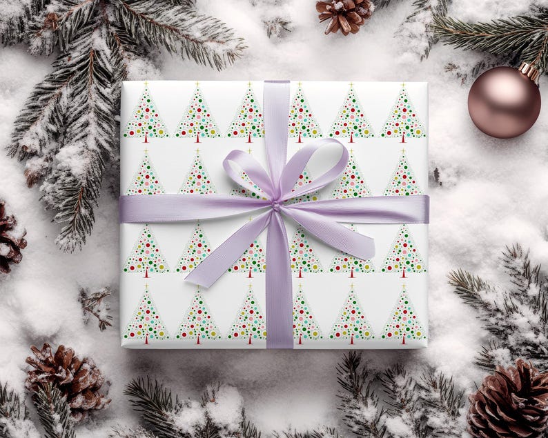 May include: White gift wrap with a repeating pattern of colorful Christmas trees. The trees are made up of small circles in shades of red, green, blue, yellow, and white. The gift wrap is tied with a lavender ribbon.