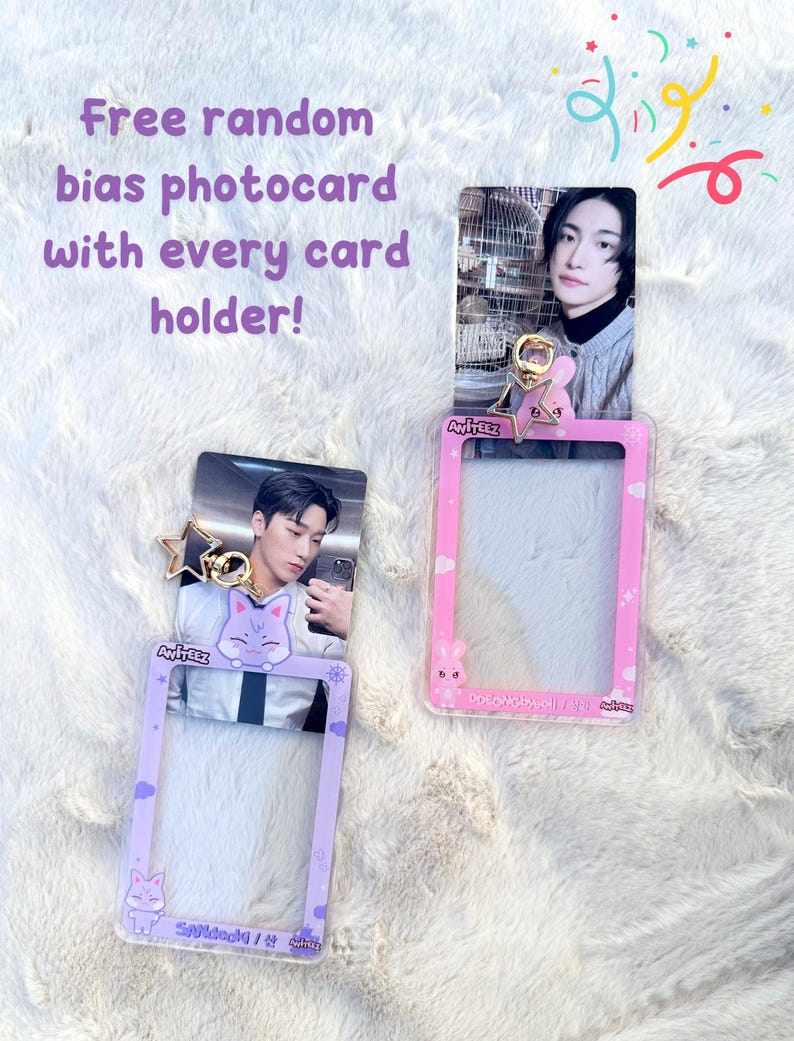 May include: Two clear plastic photo card holders with a purple and pink frame. Each holder has a cartoon animal design and a gold star charm. The text "ANITEEZ" is printed on the holders. The text "Saldeck/산" is printed on the purple holder. The text "AvirEEz" is printed on the pink holder.
