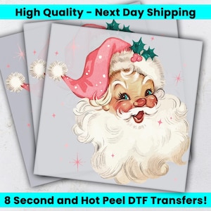 May include: A square DTF transfer sheet featuring a vintage-style illustration of Santa Claus with a pink hat, white beard, and green holly leaves. The background is light gray with small pink star accents and white pom-poms on the hat.