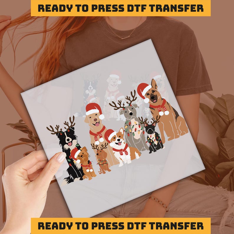 a woman holding up a picture of christmas dogs