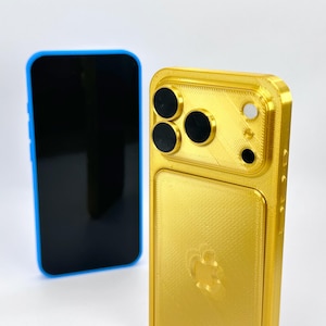 May include: Two smartphones, one with a blue frame and black screen, the other in gold. The gold phone has a textured surface and a camera array with three black lenses and a white lens.