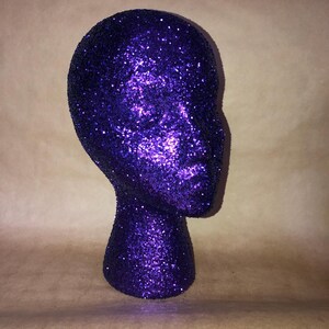 Glitter and Sparkle wig head for decorative purposes, holding wigs, or salon decorations.  Any color you&#39;d like.