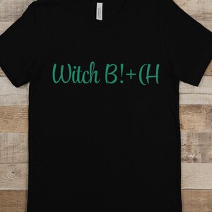 May include: Black t-shirt with the text "Witch B!+CH" in green.