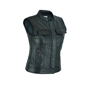 May include: Black leather motorcycle vest with a zipper closure and multiple pockets. The vest has a stand-up collar and a "RONS" label on the front.