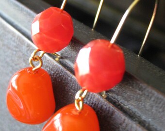 Red-orange dangle earrings