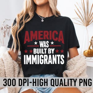May include: A black t-shirt with white text that reads "America was built by immigrants". The text is surrounded by red stars.
