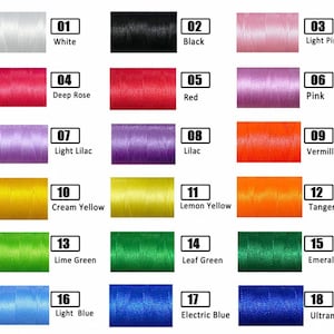 May include: A color chart displaying 18 spools of thread in various colors. Colors include white, black, light pink, deep rose, red, pink, light lilac, lilac, vermillion, cream yellow, lemon yellow, tangerine, lime green, leaf green, emerald green, light blue, electric blue, and ultramarine.