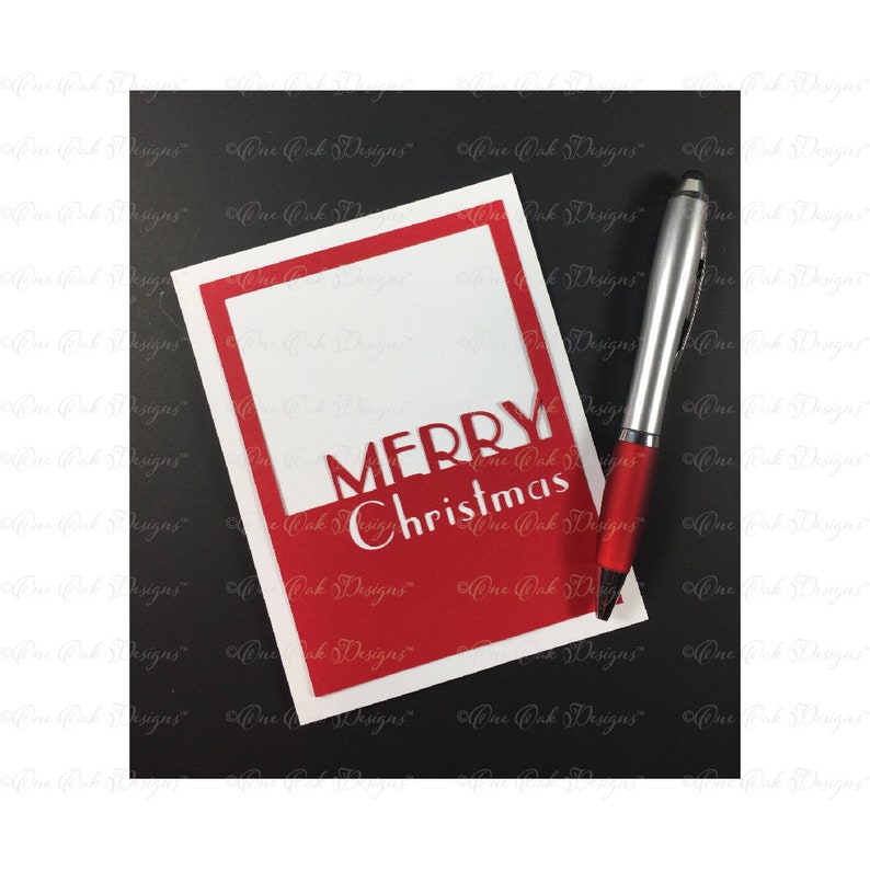 May include: A white card with a red frame and the words "MERRY Christmas" in red lettering.