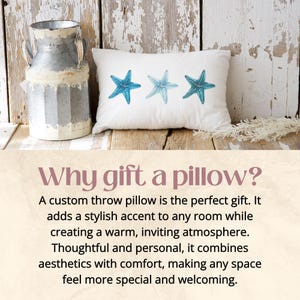 a pillow with three starfishs on it next to a vase
