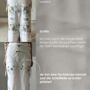 May include: A white skirt with a floral embroidery pattern. The skirt has a slit in the back and is made from a linen fabric. The text "Schlitz" is written on the image, which is German for "slit".