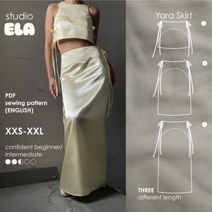 Pode incluir: Um padrão de costura para uma saia Yara em três comprimentos diferentes. O padrão está disponível nos tamanhos XXS-XXL e é para uma costureira iniciante ou intermediária. O padrão é para uma saia com um tecido de cetim e laços na cintura.