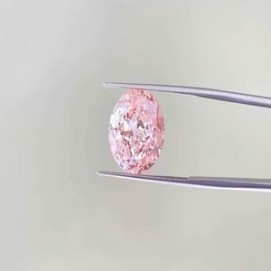 IGI Certified Fancy Vivid Pink Lab Grown Diamond: Oval Cut VS1 CVD Diamond