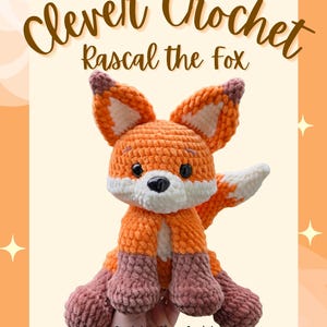 May include: A crocheted fox toy named "Rascal" in shades of orange, white, and mauve. The fox has large ears, a white chest, and mauve paws. The text "Clever Crochet" and "Rascal the Fox" are displayed above the fox. The text "Created by Clever Crochet" and "Clevercrochet.ca" are displayed below the fox.