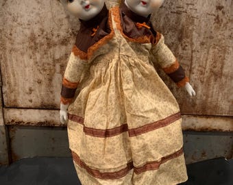 creepy cute two headed doll