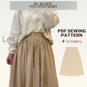 Puede incluir: Un patrón de costura PDF y un tutorial para una falda plisada. El patrón es para las tallas 36-46. La imagen muestra a una mujer usando una falda beige con un cinturón dorado.