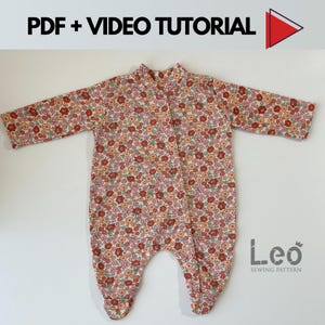 May include: A white baby onesie with a floral print in shades of red, pink, and green. The onesie has long sleeves and a snap closure at the crotch. The text "Leo Sewing Pattern" is printed on the bottom right corner of the onesie.