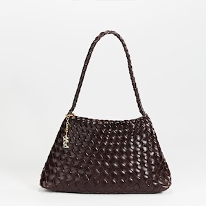 May include: A set of three ceramic mugs with a speckled, matte finish. The mugs are in shades of cream, light gray, and dark gray. Each mug has a simple, minimalist design and a rounded handle.