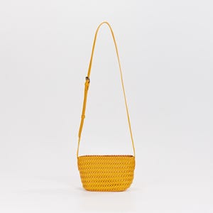 May include: A yellow woven crossbody bag with a long, adjustable strap. The bag has a rectangular shape and a woven texture. The strap is attached to the bag with a buckle. The bag is made of a durable material and is suitable for everyday use.