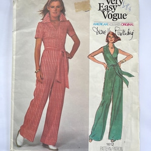 May include: Vintage Very Easy Vogue sewing pattern featuring a jumpsuit design. The pattern includes a red jumpsuit with a collared neckline and a matching belt. The cover also shows a green jumpsuit illustration. The pattern is an American Designer Original by Diane Von Furstenberg.