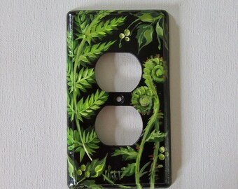 Outlet fern design on black background